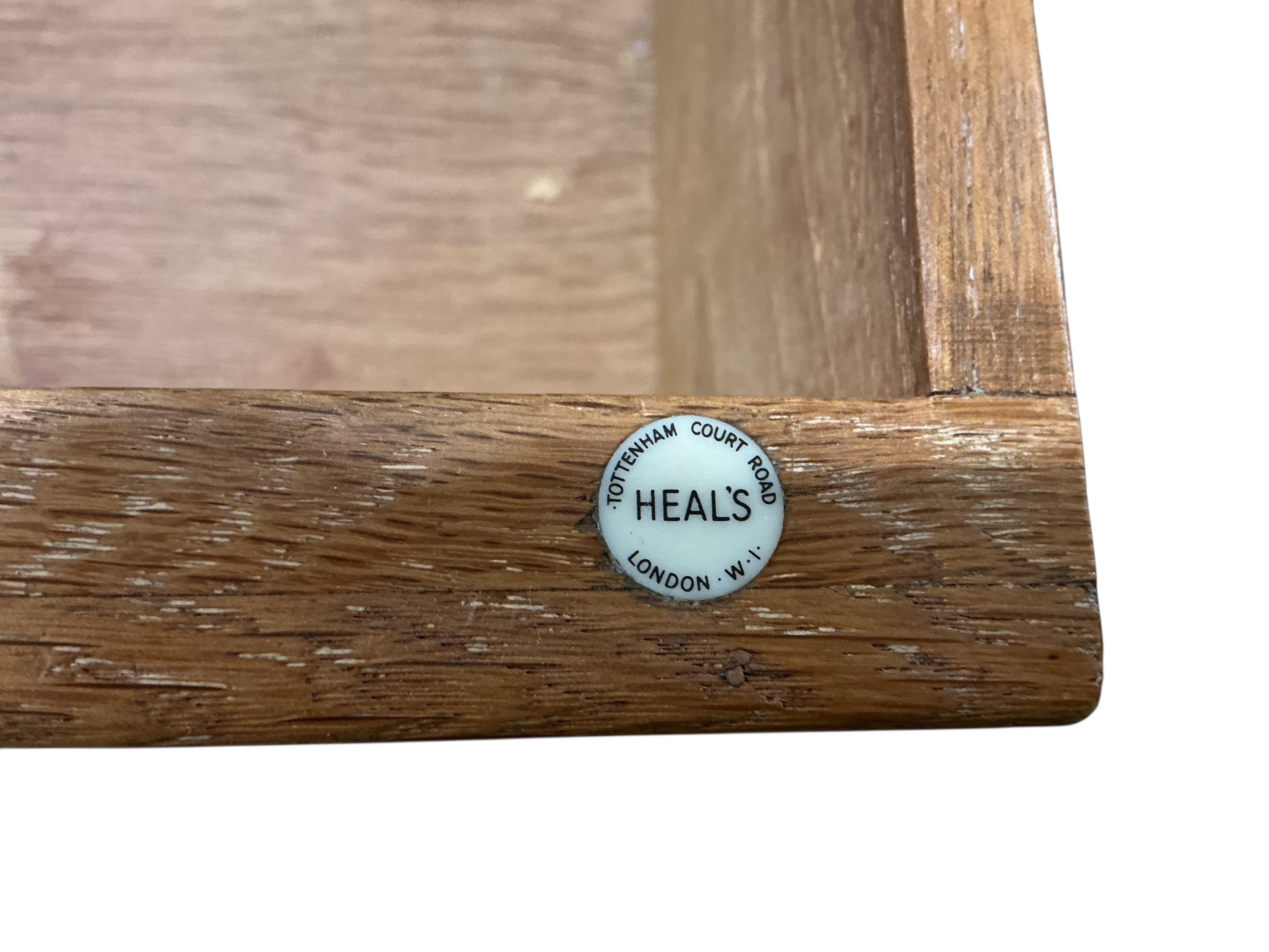 A Heals oak kneehole dressing table, width 114cm, depth 56cm, height 168cm